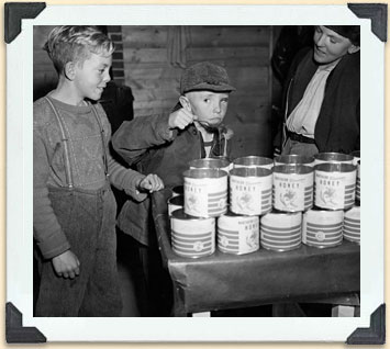 Taste-testing the product before putting on lids, ca 1940. 