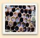 Worker bees feed the larvae in the cells of a brood box. 