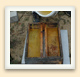 The top feeder's two troughs of syrup, separated by a wooden board, allow the bees to feed without drowning. 