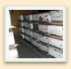 Hive boxes are kept on pallets with aisles between them to ensure proper air flow and ease of handling. 